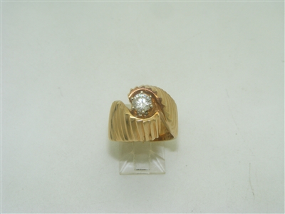 14k yellow gold deigned ring with one diamond